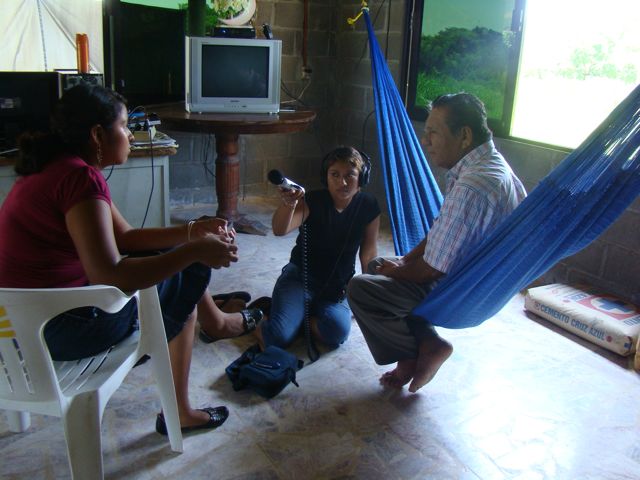 Two young female broadcasters conducting an interview in Oaxaca