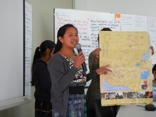 Indigenous woman explaining map