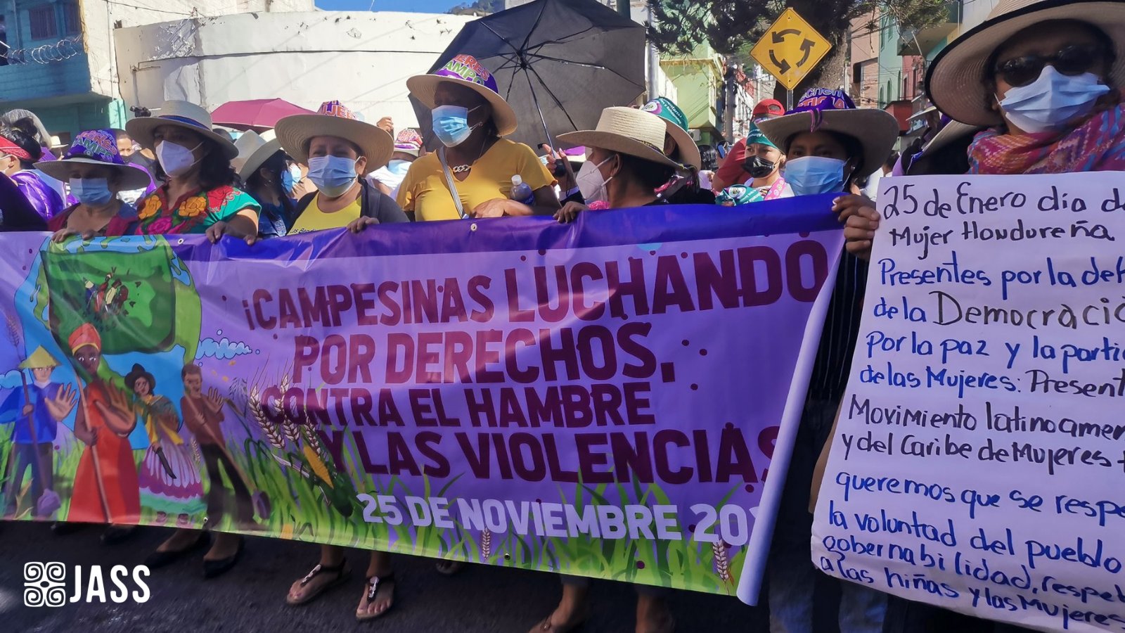 JASS and allies carrying banners in Honduras in celebration of Honduran Women's Day