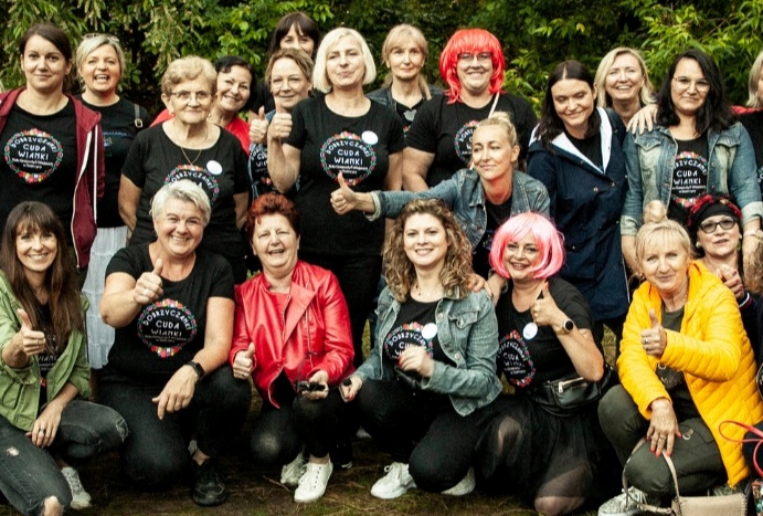 FemFund members gathered to celebrate Feminist Day giving a thumbs up to the camera