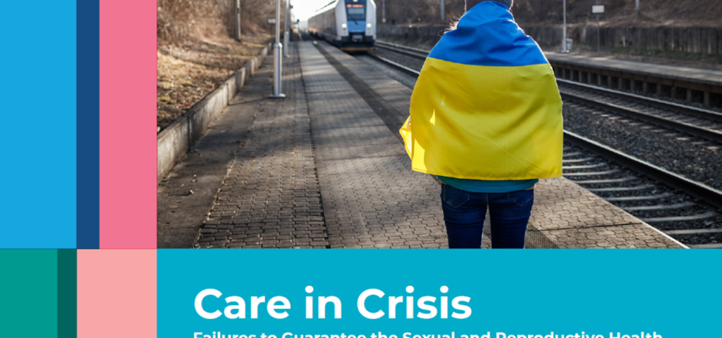 women standing with Ukrainian flag (yellow and blue stripes) around shoulder standing at train stop